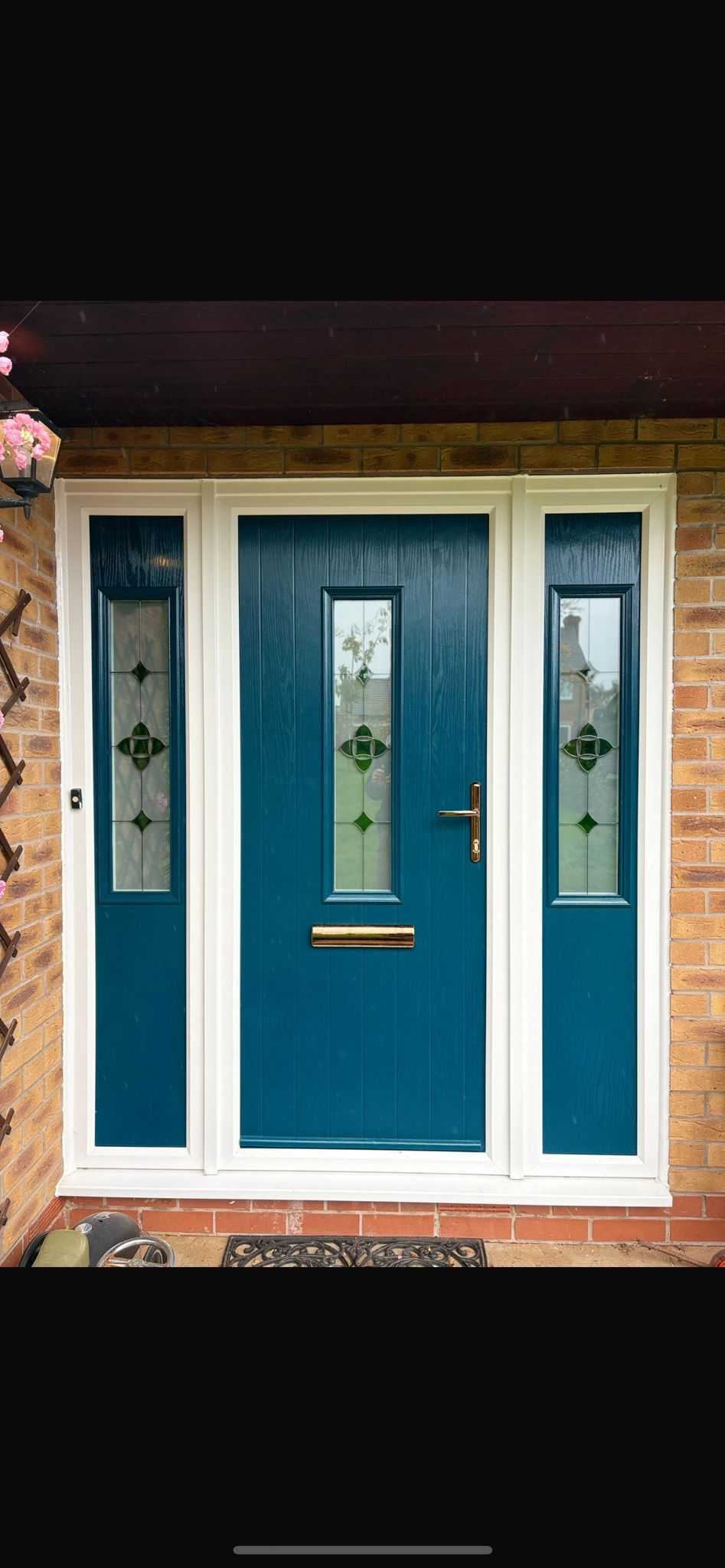 Premium teal composite door with decorative glass sidelights - professional installation by CJB Renovations LTD in Wantage, Oxfordshire
